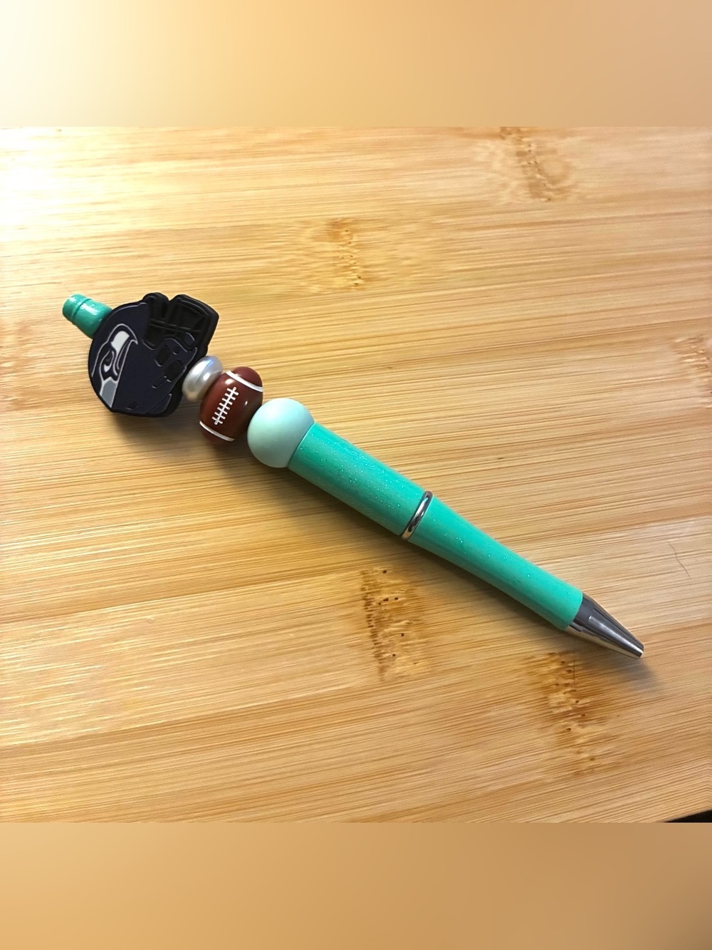 Teal Glitter Beaded Ballpoint Pen with Seahawks Football Bead